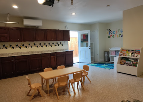 Dining and learning area with wooden furniture and alphabet decorations